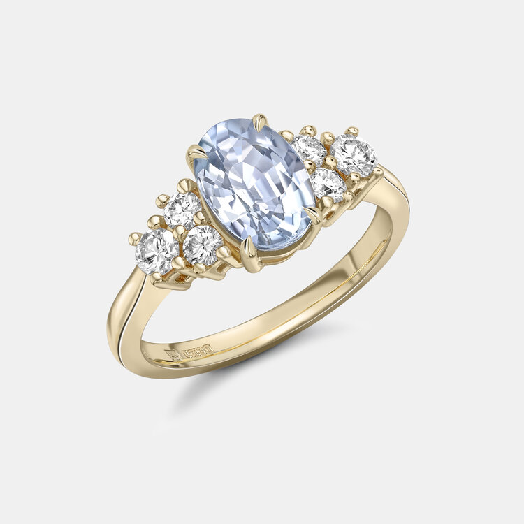 Bespoke Pale Blue Sapphire Engagement Ring with Round Diamonds in Yellow Gold